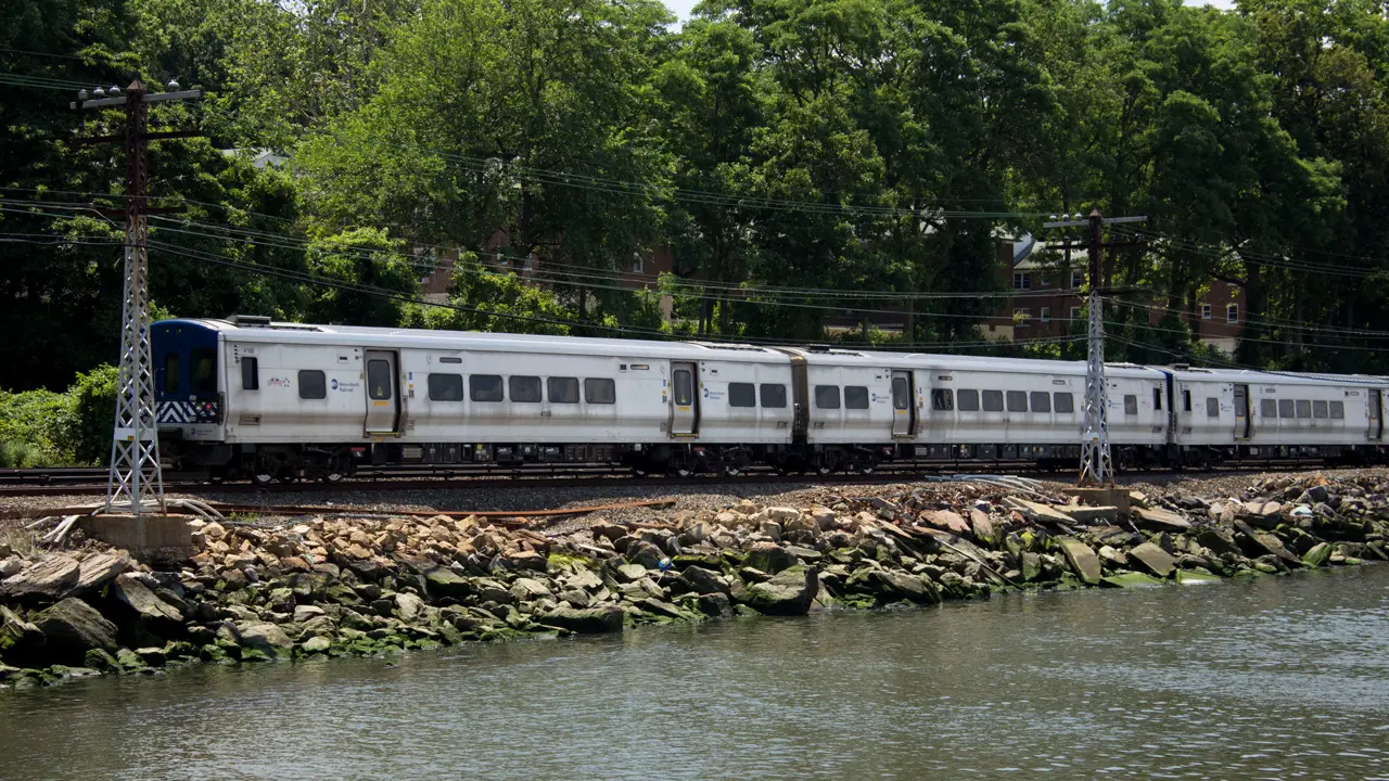 The back of a Metro North train heading toward Grand Central.